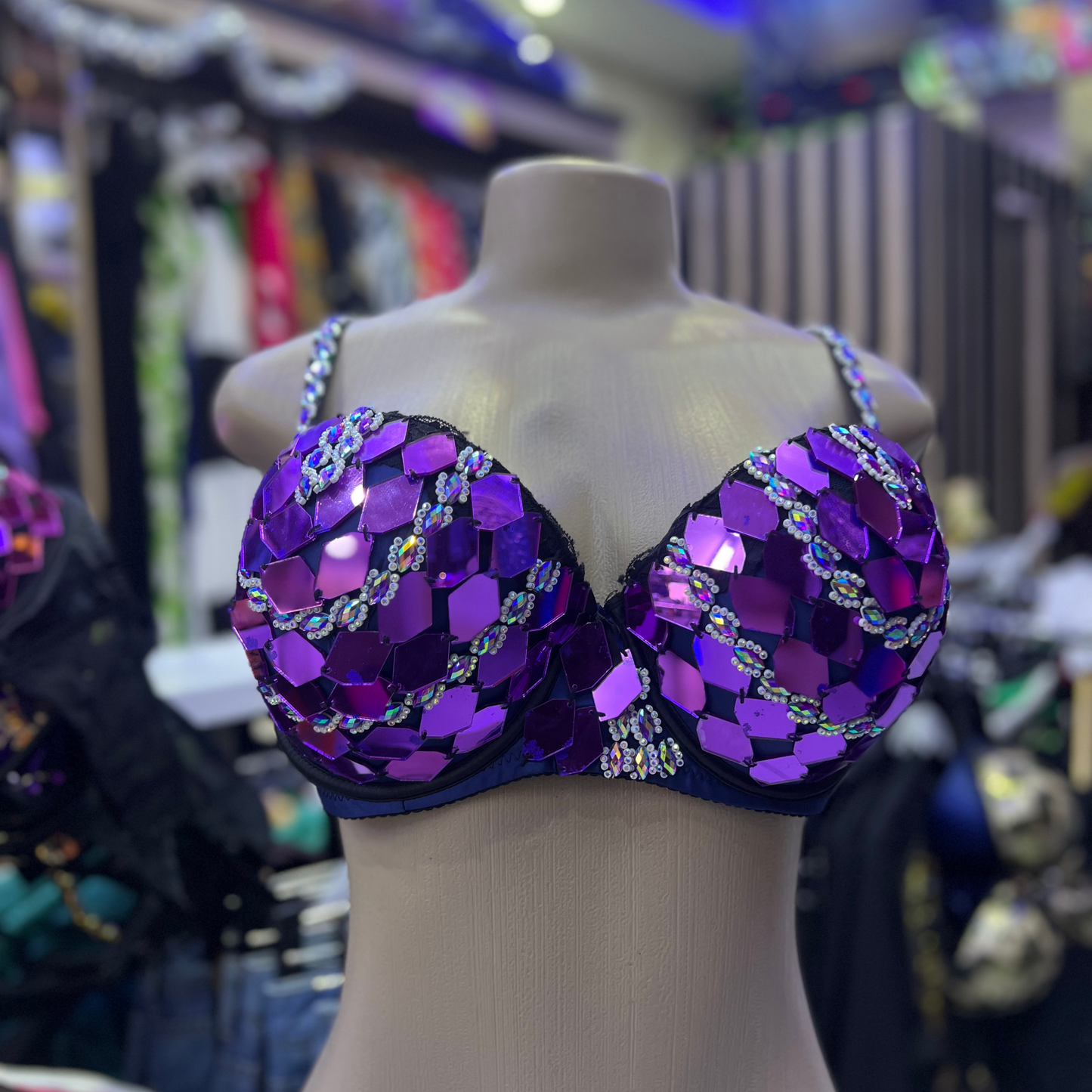 Sparkly purple sequined bra top featuring dazzling embellishments from MazzyCosmetics-spa, Enchanted Emerald