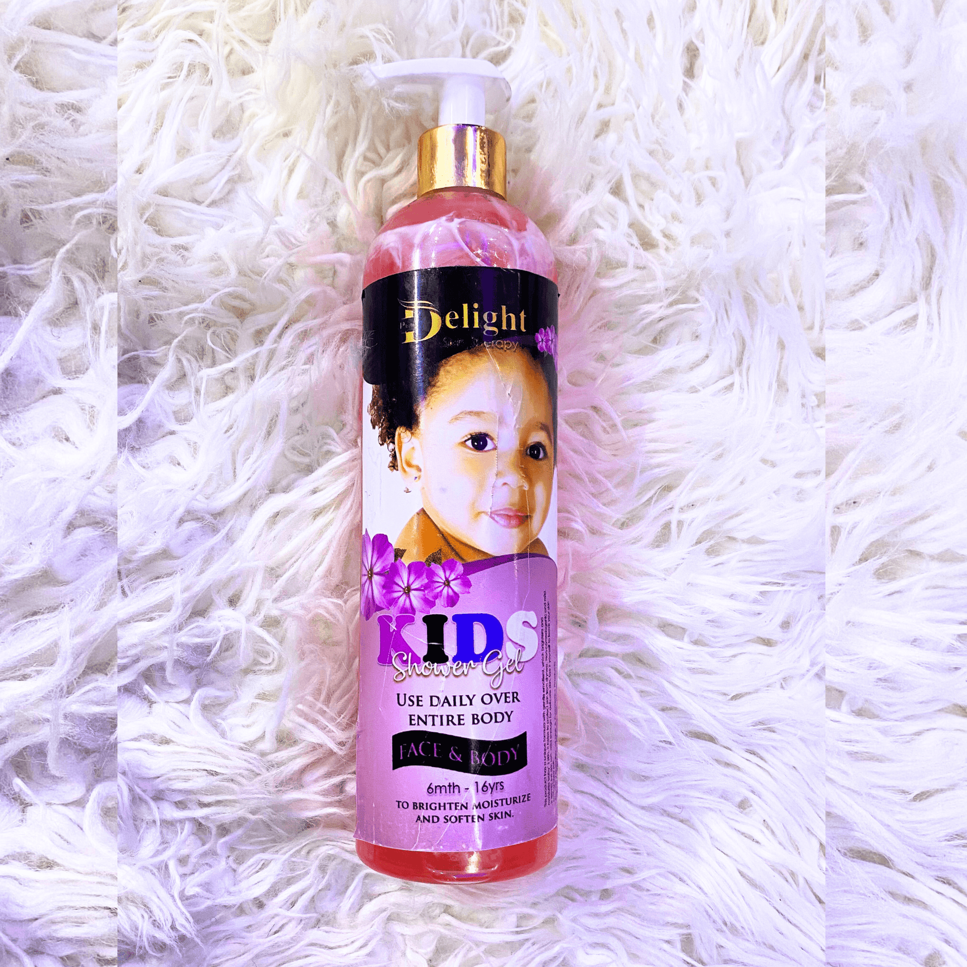 Bottle of 'Delight' Kids shower gel on a white textured background
